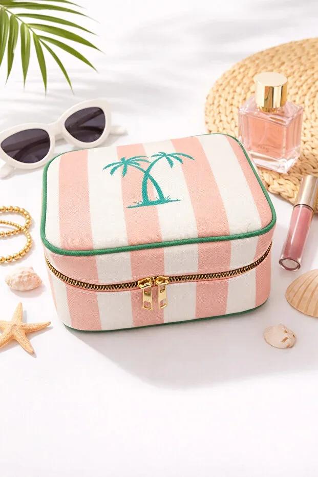 Pink and white striped makeup bag with tropical palm detail