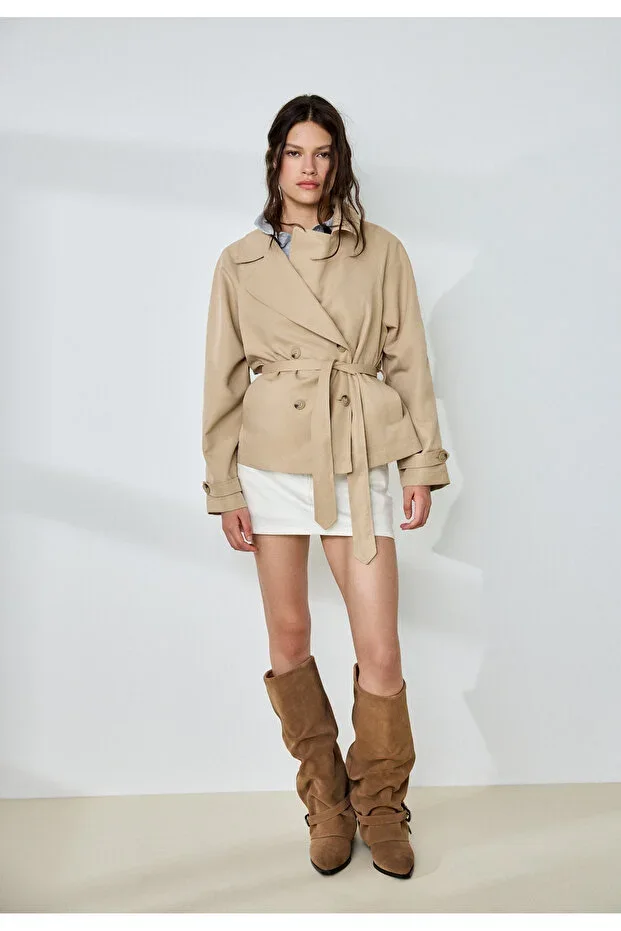 Short trench coat with belt and drape