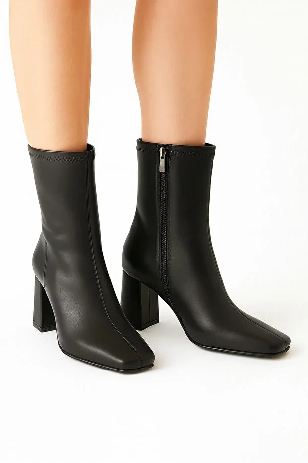 Heeled stretch ankle boot with side zipper