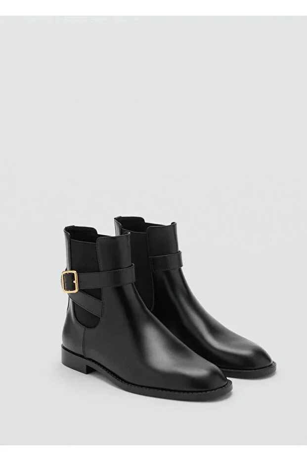Ankle boots with buckle and elastic panel